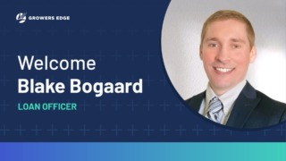 Headshot of a young white man in a suit with the words "Welcome Blake Bogaard Loan Officer"