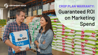A man and a woman in an ag retail store. The man is holding a bag of product. Text reads "Crop Plan Warranty: Guaranteed ROI on Marketing Spend"